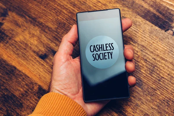 Cashless society concept, man using smartphone for electronic pa
