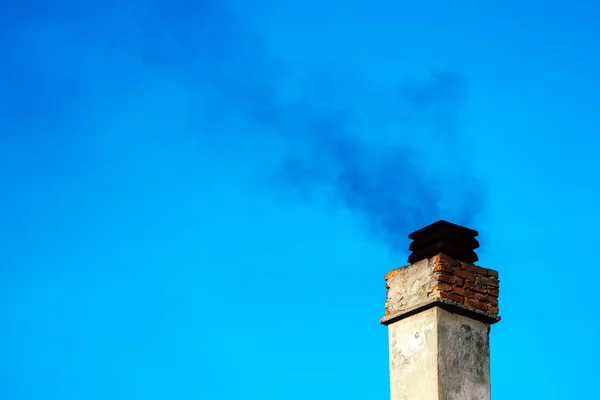 Smoke from house chimney — Stock Photo, Image