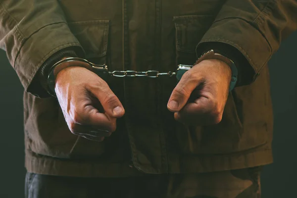 Handcuffed soldier in prison — Stock Photo, Image