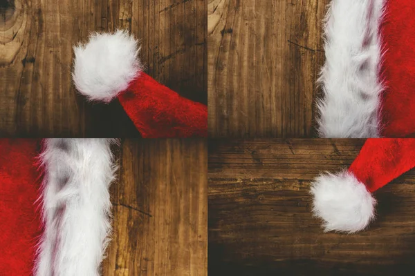 Santa Claus klobouk na dřevěné desce — Stock fotografie