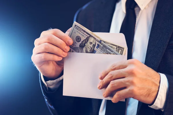 Bribery and corruption concept with cash money in envelope — Stock Photo, Image