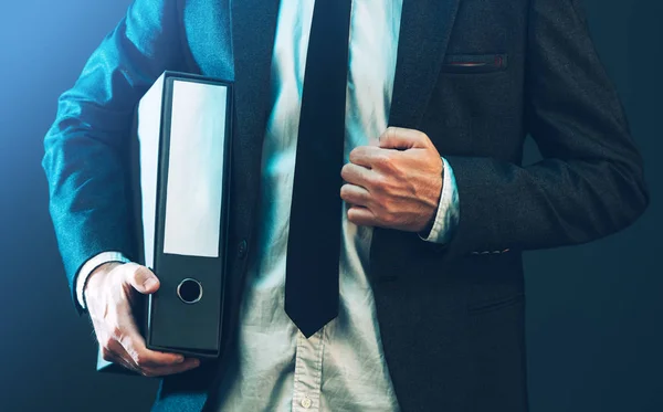 Businessman with corporate files in document binder — Stock Photo, Image