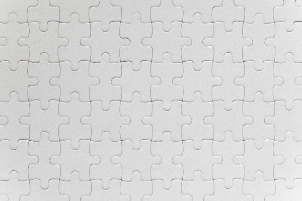 Blank white jigsaw puzzle pieces completed — Stock Photo, Image