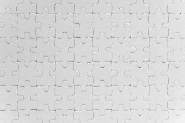 Blank white jigsaw puzzle pieces completed