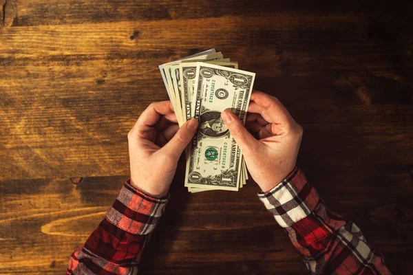 Top view of female hands with US dollar banknotes — Stock Photo, Image