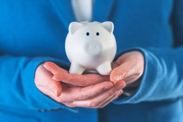 Businesswoman with piggy coin bank — Stock Photo, Image