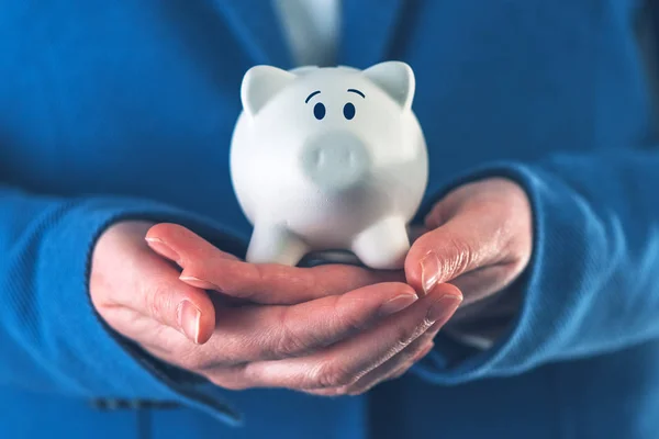 Businesswoman with piggy coin bank — Stock Photo, Image