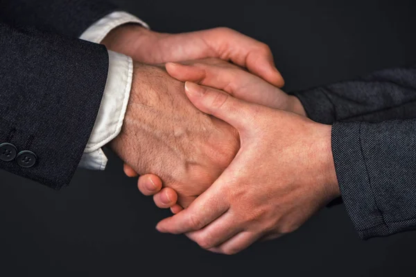 Businessman and businesswoman handshake in office — Stock Photo, Image