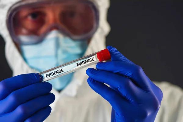 Forensic scientist with evidence tube — Stock Photo, Image