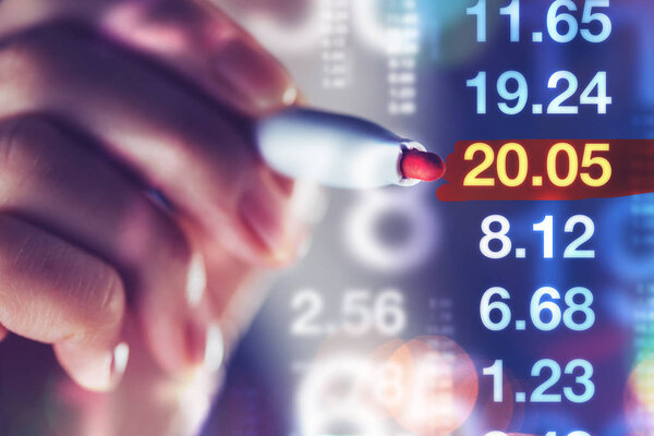 Businesswoman tracking stock market indicators