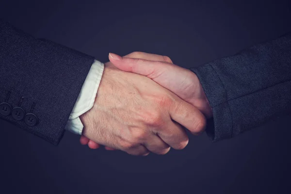 Joint venture business handshake — Zdjęcie stockowe