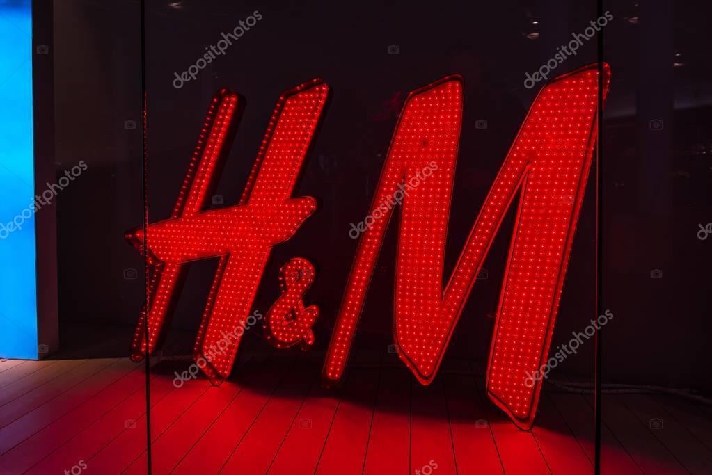 MALMO, SWEDEN - MARCH 08, 2017: H&M logo in department store window in Malmo's Emporia Shopping Center, the largest shopping mall in Scandinavia.