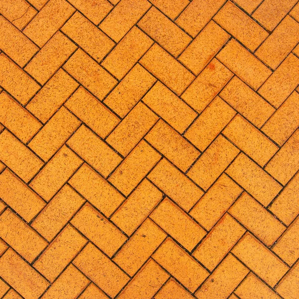 Orange zigzag brick paving texture — Stock Photo, Image