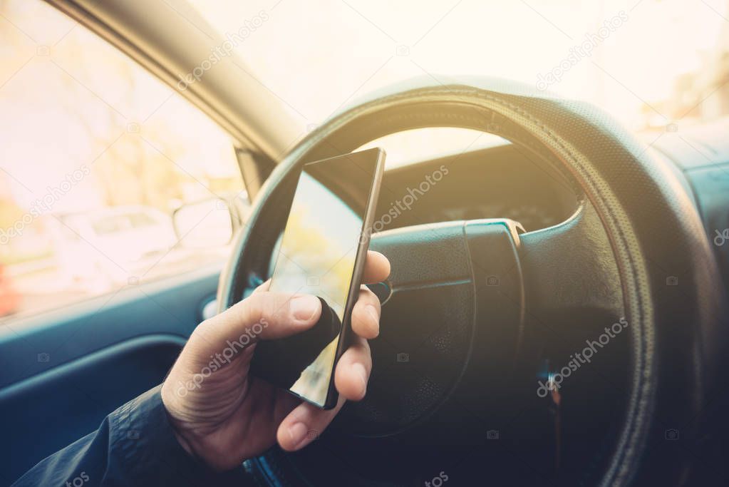 Using mobile phone and driving car