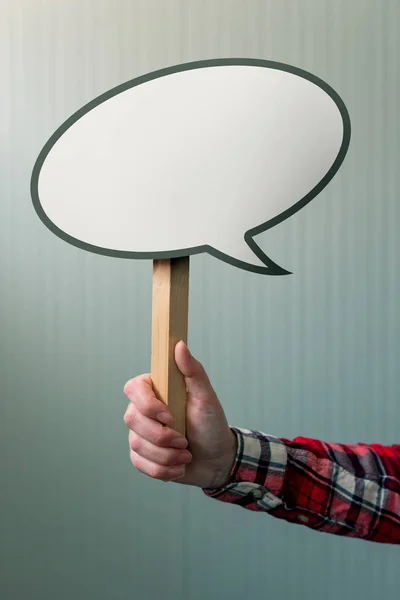 Female hand with speech bubble balloon as copy space — Stock Photo, Image