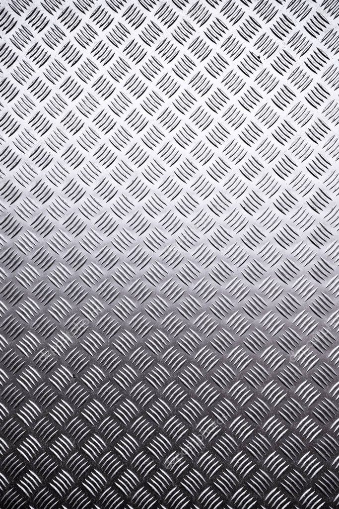 Metal surface background with repeative diamond pattern