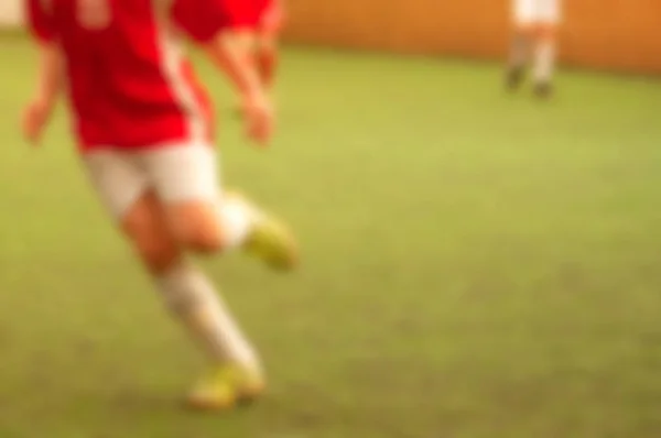 Blur miúdo jogador de futebol — Fotografia de Stock