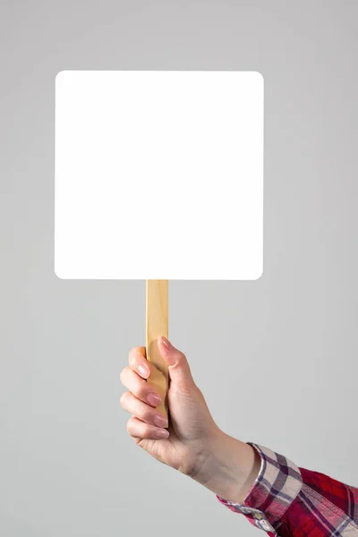 Female hand holding blank mockup banner sign as copy space — Stock Photo, Image