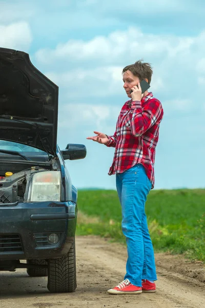 Unhappy frustrated female calling car mechanic repair shop