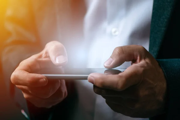 Businessman playing mobile app video game on smart phone — Stock Photo, Image