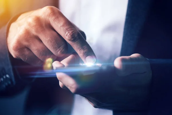 Businessman pushing mobile phone touch screen — Stock Photo, Image