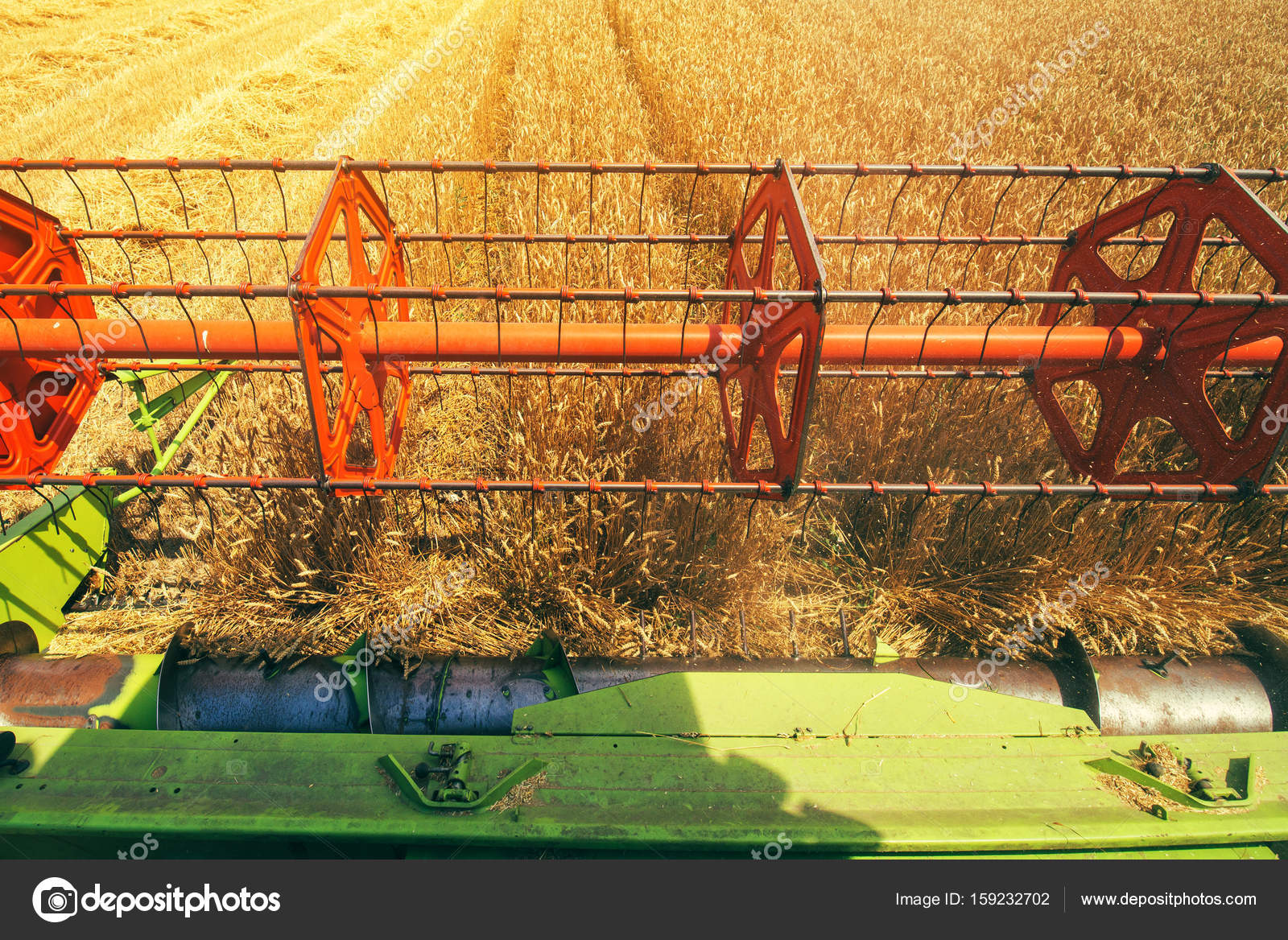 Combine harvester revolving reel from farmers pov — Stock Photo