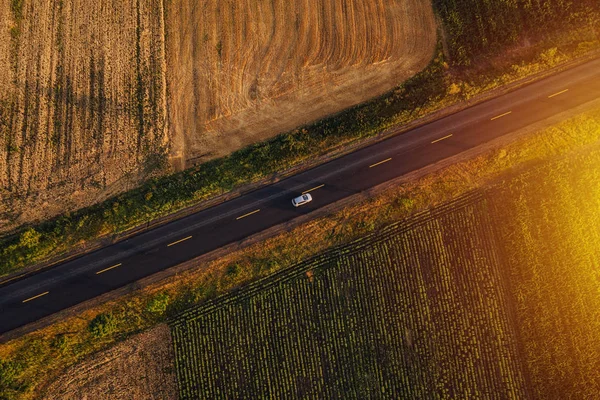 Aerial view of cars on the road in sunset — Stock Photo, Image