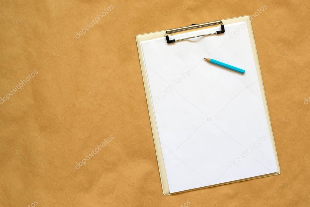 Pencil, clipboard and note paper as copy space