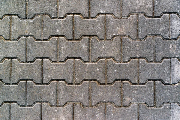 Тротуарные бетонные плиты в форме H вид сверху — стоковое фото