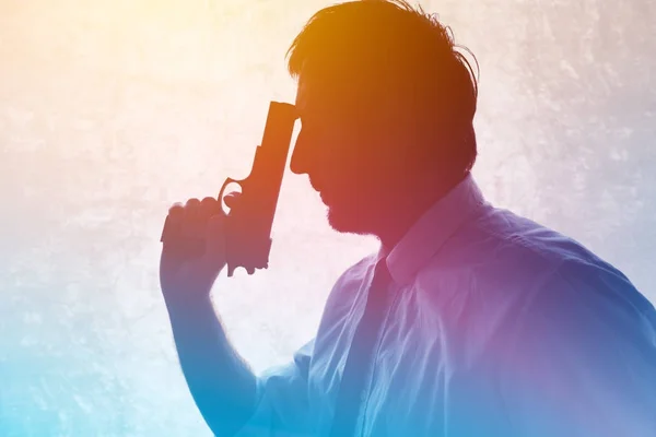 Silhouette of a man with a gun — Stock Photo, Image