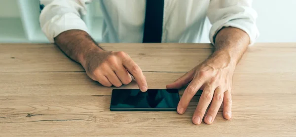 Smartphone in hands of successful businessman — Stock Photo, Image