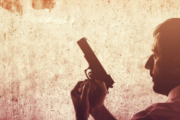 Man with a gun — Stock Photo, Image