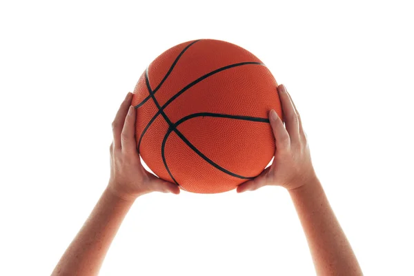 Female hand with basketball ball isolated on white background Stock Picture