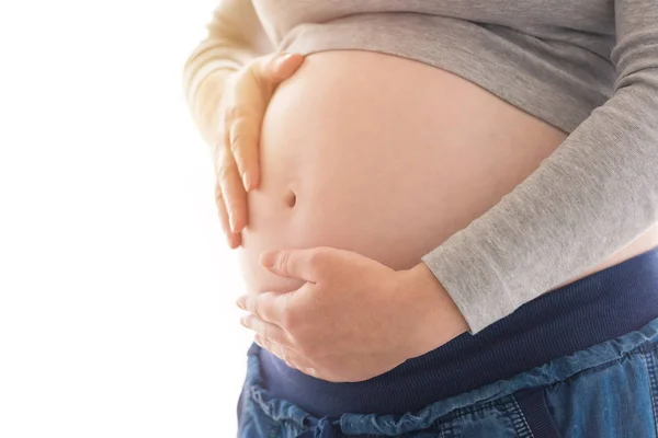 Terhes nő, megható és dörzsölés a hasát — Stock Fotó