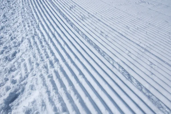 Groomed ski run track in snow — Stock Photo, Image