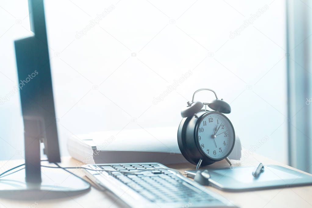 Business project deadline, vintage clock on office desk