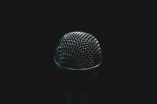 Audio microphone isolated on dark background — Stock Photo, Image