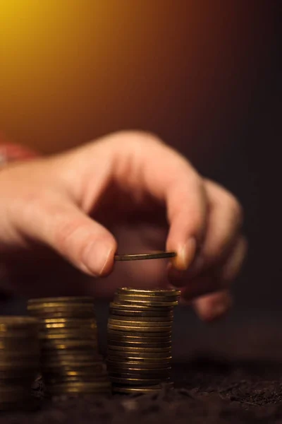 Farmer stacking coins, agricultural income — Stock Photo, Image