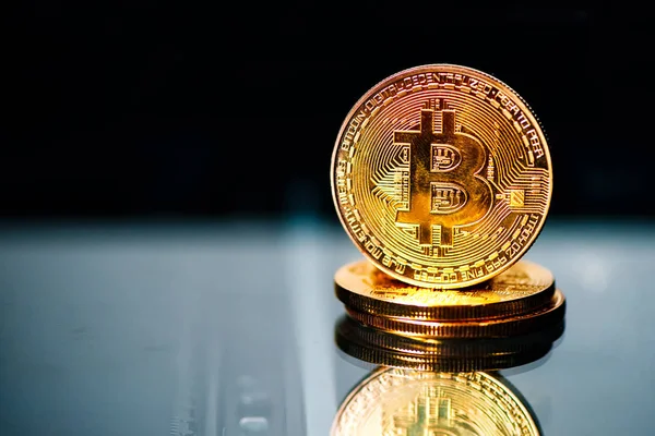 Bitcoins on reflective surface — Stock Photo, Image