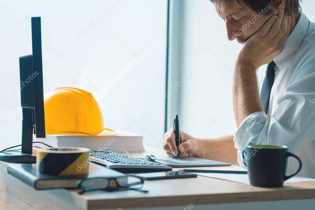 Interior design professional working on graphic tablet sketch pa