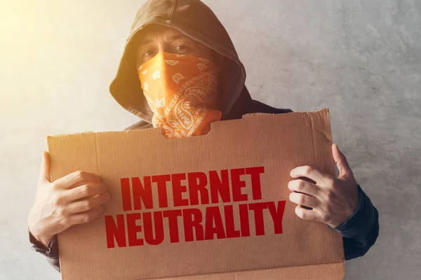 Hooded activist protestor holding Internet neutrality protest si — Stock Photo, Image