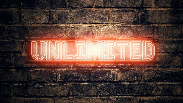 Unlimited neon sign on brick wall — Stock Photo, Image