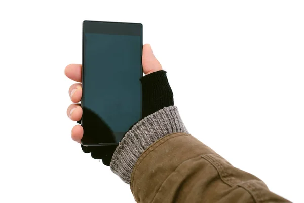 Męskiej ręki trzymającej smartphone na zewnątrz w zimie — Zdjęcie stockowe