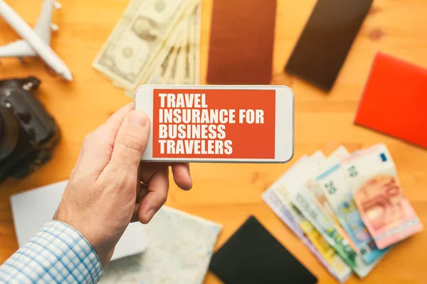 Travel insurance for business travelers online mobile phone app — Stock Photo, Image