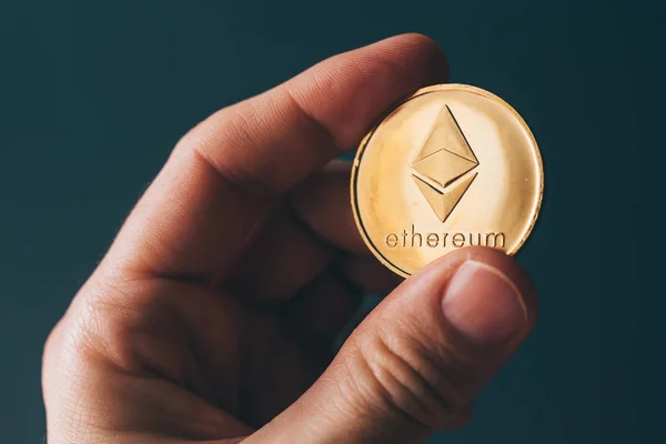 Ethereum cryptocurrency in hand — Stockfoto