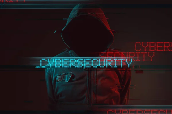 Cybersecurity concept with faceless hooded male person — Stock Photo, Image