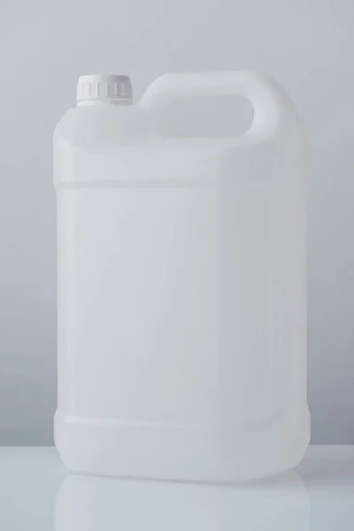 White plastic jerrycan canister for chemical liquids — Stock Photo, Image