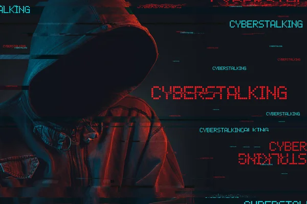 Cyberstalking concept with faceless hooded male person — Stock Photo, Image