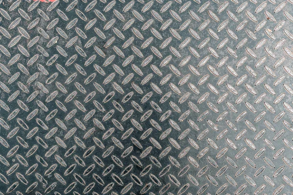 Weathered anti-slip perforated metal sheet surface as background — Stock Photo, Image