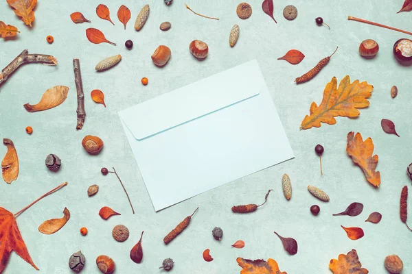 Blank post mail envelope mock up with autumn arrangement